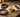 Skidmore's Leather Cream, a buckstitch belt, and split reins on a workbench