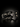Pair of Western spurs with black steel body and silver floral scroll overlay
