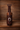Leather saddle water bottle holder with basket weave top.