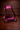 Pink leather stirrup on a wooden background