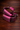 Pink Stirrups laying on side to feature leather tread 