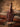 Fixed blade knife seated in a dark leather belt sheath with only the handle showing, against a wool western blanket