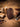 Handmade dark leather fixed blade knife sheath on a leatherworking bench with stitching tools and thread