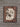 Hair on hide padfolio front with brown and white cowhide panel and tooled floral leather border on barnwood