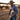 Cowboy carrying the hair on hide cowhide portfolio #3 under his arm at an arena fence
