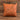 Tan leatherette 15 inch throw pillow with a laser engraved show goat silhouette on the front, set on weathered barnwood