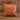 Tan leatherette 15 inch throw pillow with a laser engraved show heifer silhouette on the front, set on weathered barnwood