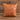 Tan leatherette 15 inch throw pillow with a laser engraved show pig silhouette on the front, set on weathered barnwood
