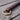 Close-up of the solid brass rein ring and stitched loop on a chocolate Hermann Oak harness leather training fork