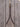 Leather training fork in chocolate brown Hermann Oak harness leather with solid brass snap, buckle and rein rings, laid on weathered barnwood