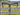 Pink buckstitch straight breast collar in dark oil bridle leather hanging on a wood fence, full view with center concho, tug straps and cinch strap