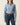 Woman wearing Pink Heritage Buckstitch Belt with chambray shirt and dark jeans, front studio view of handmade leather western belt